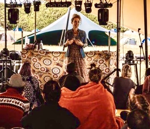 Deb speaking on stage
